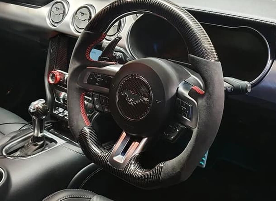 Custom design steering wheel- By Eximius. Alcantara leather and Carbon - red stitching. For the Mustang GT.