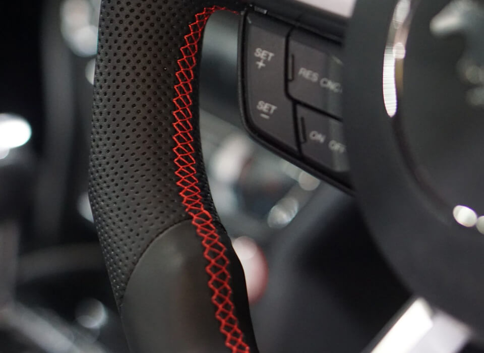 Custom design steering wheel- By Eximius. Leather. Red Stitching.