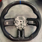 Custom design steering wheel- By Eximius. Blue racing stripe. Carbon Bezel