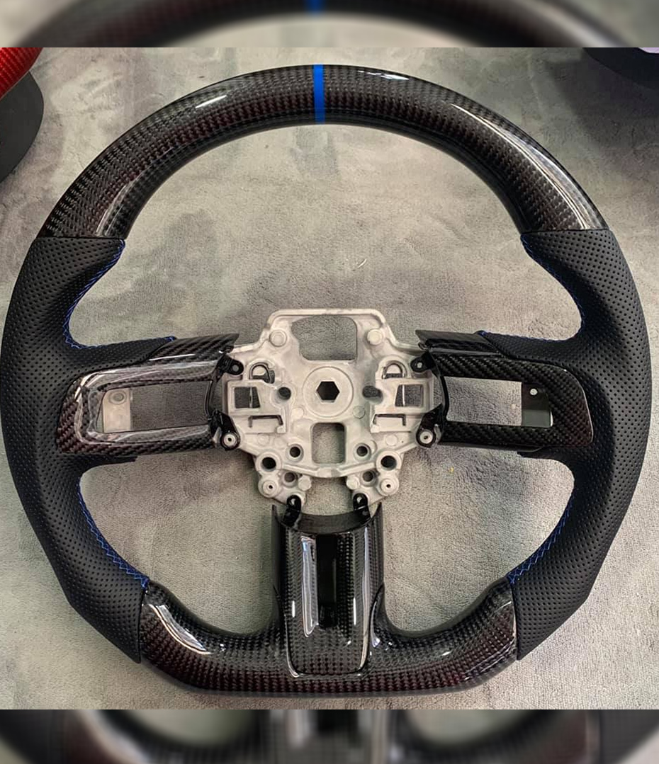 Custom design steering wheel- By Eximius. Leather and Carbon.For the Mustang GT. With center Bezel.